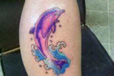 Purple and blue tattoo on the leg