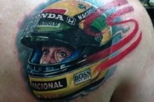 Racing helmet tattoo on the shoulder