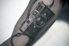 Realistic camera with strap tattoo