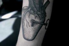 Realistic heart and key tattoo
