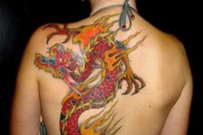 Red dragon and flame tattoo on the back