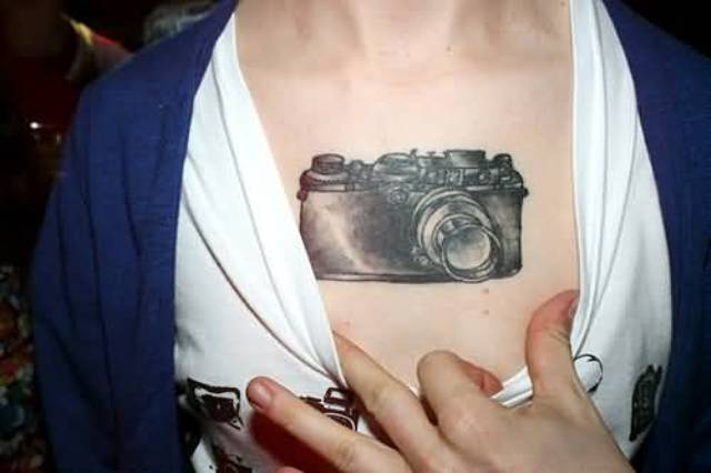 Retro camera tattoo on the chest