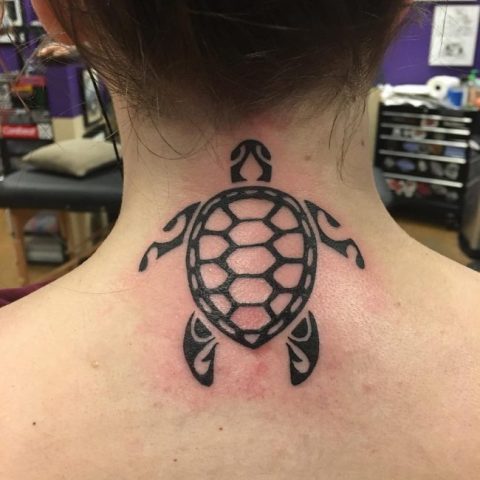 Simple tribal turtle tattoo on the neck