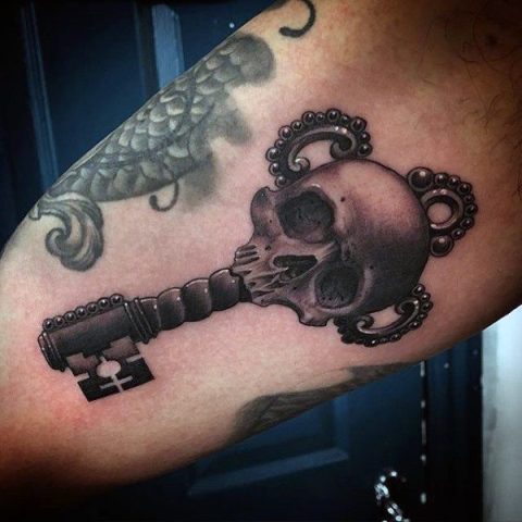 Skeleton key tattoo on the arm
