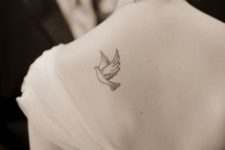 Small dove tattoo on the back