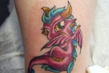 Small dragon tattoo on the leg