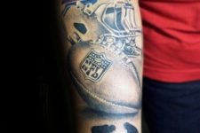 Stylish tattoo with helmet, football and two players