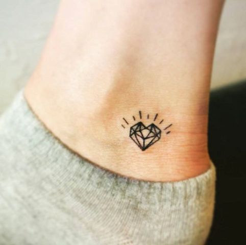 Tiny diamond tattoo on the ankle