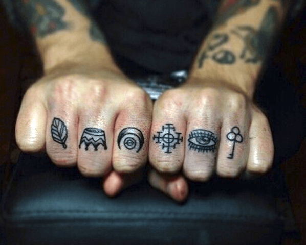 Tiny tattoos on the fingers