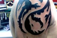 Tribal dragon tattoo idea on the shoulder