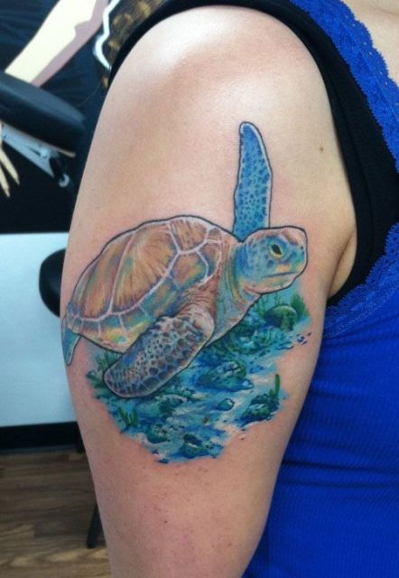 Turtle and sea tattoo on the arm