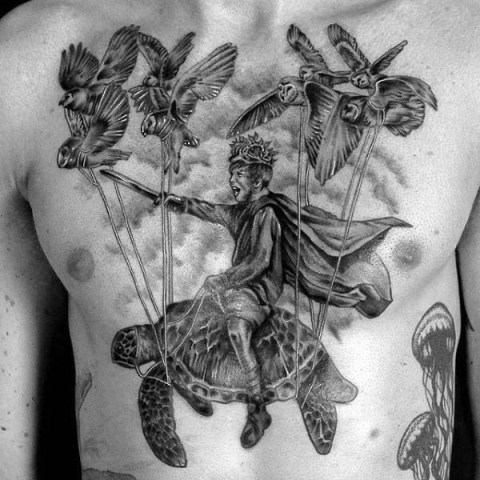 Turtle, man and birds tattoo on the chest