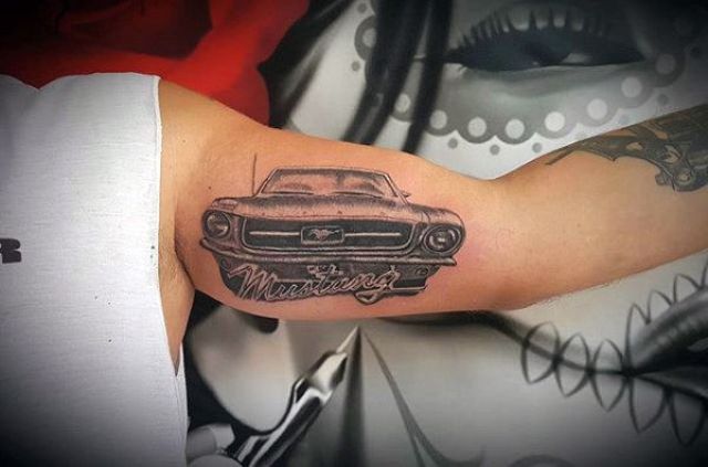 Unique mustang tattoo on the biceps