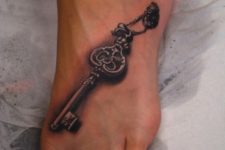 Vintage key tattoo idea on the foot
