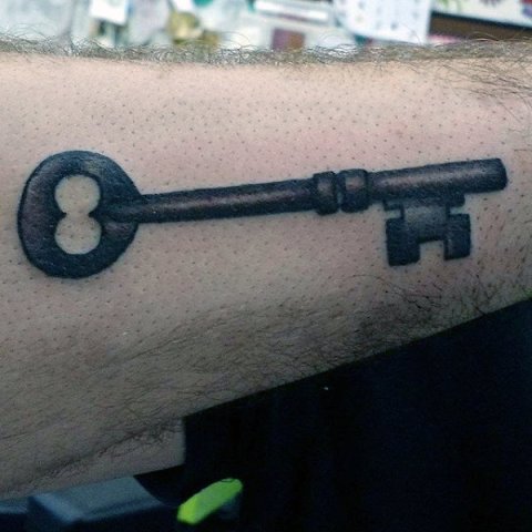 Vintage key tattoo on the hand