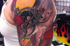 Yellow and red football tattoo