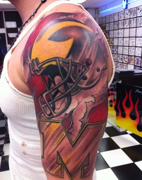 Yellow and red football tattoo