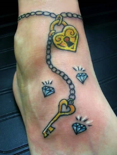 Yellow key and diamonds tattoo