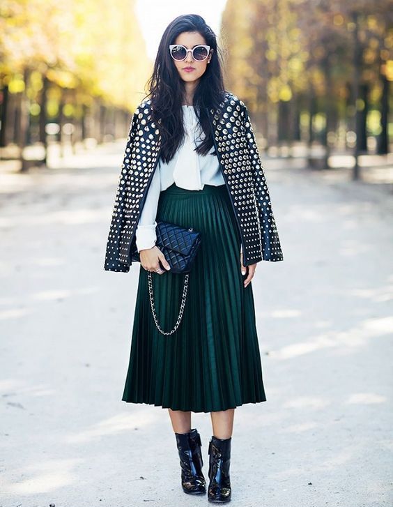 a dark green pleated midi skirt, a white shirt, a nail leather jacket and black booties