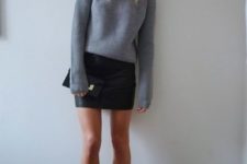 04 a black leathe rmini skirt, a grey sweater and black leather sock booties