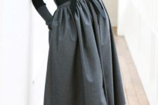 04 a black turtleneck, black shoes and a grey A-line full skirt with pockets