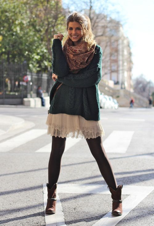 an oversized dark green sweater, a white lace skirt, black tights, brown booties and a brown scarf