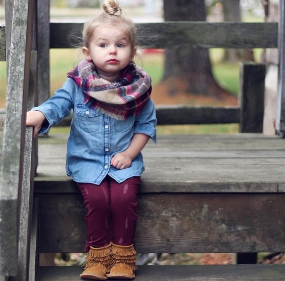 thanksgiving outfit with a chambray shirt, burgundy pants, a plaid infinity scarf and brown suede booties