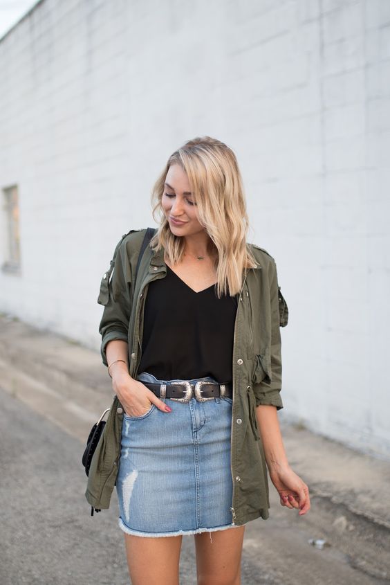 a black top, a denim mini skirt, an olive green shirt to cover up