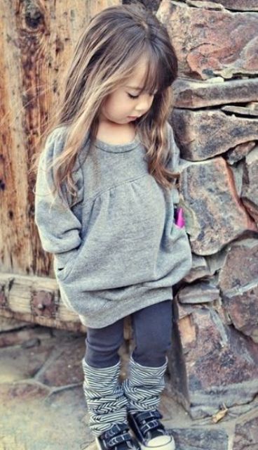 a grey sweater dress, brown leggings, striped legwarmers, sneakers for a cute and comfy fall look
