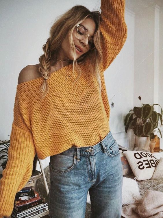 a mustard off the shoulder sweater and jeans for an effortlessly chic look with a fall feel