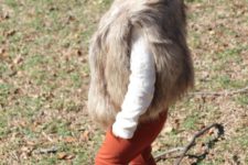 09 burnt orange pants, a white polka dot sweater, a faux fur vest and beige leather boots