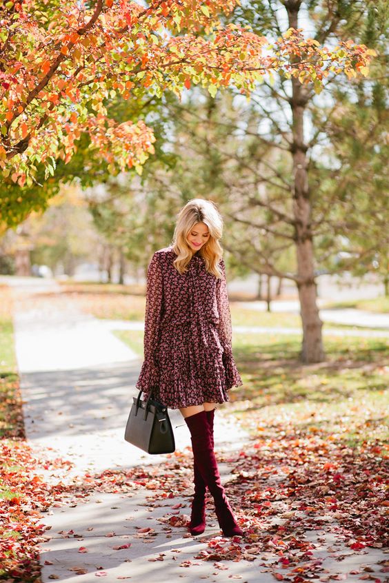 a pink floral dress, burgundy tall suede boots and a black bag for a sexy girlish look
