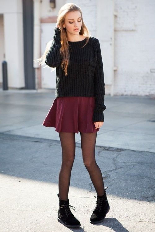 a black slouchy sweater, a burgundy skater skirt, black tights and black suede boots