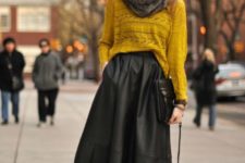 14 a mustard top, a black A-line midi skirt, suede booties, a faux fur scarf and a clutch