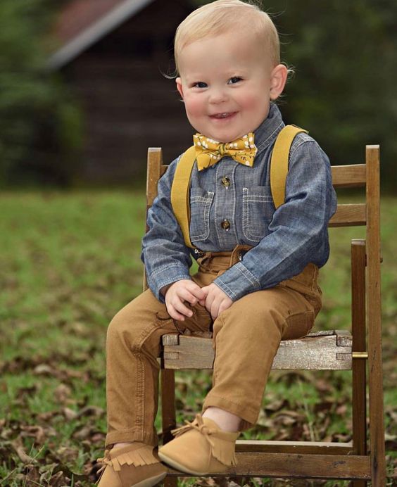 amber jeans and booties, a chambray shirt, mustard suspenders and a bow tie for a vintage look