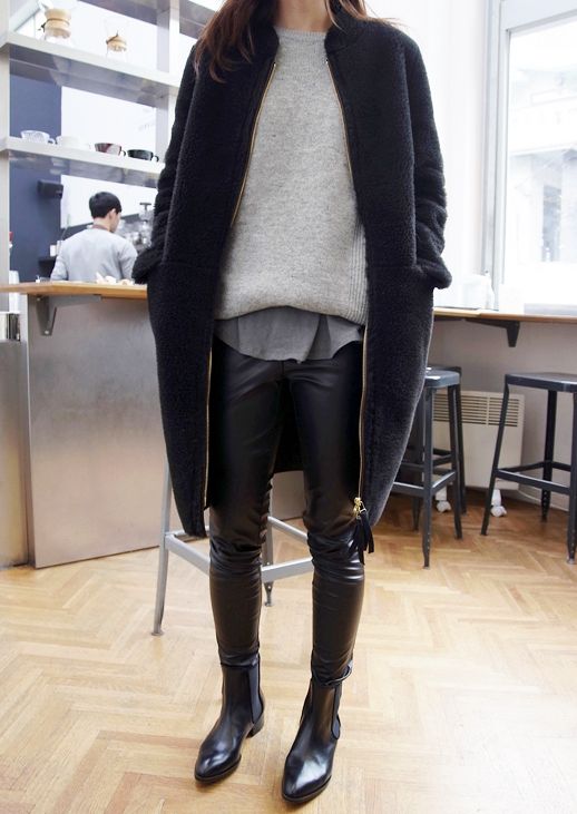 black leather leggings, black chelsea boots, a grey tee, s grey sweater and a navy coat