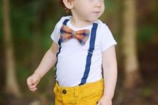 15 bold yellow jeans, a white tee with blue suspenders and a plaid bow tie for a chic look