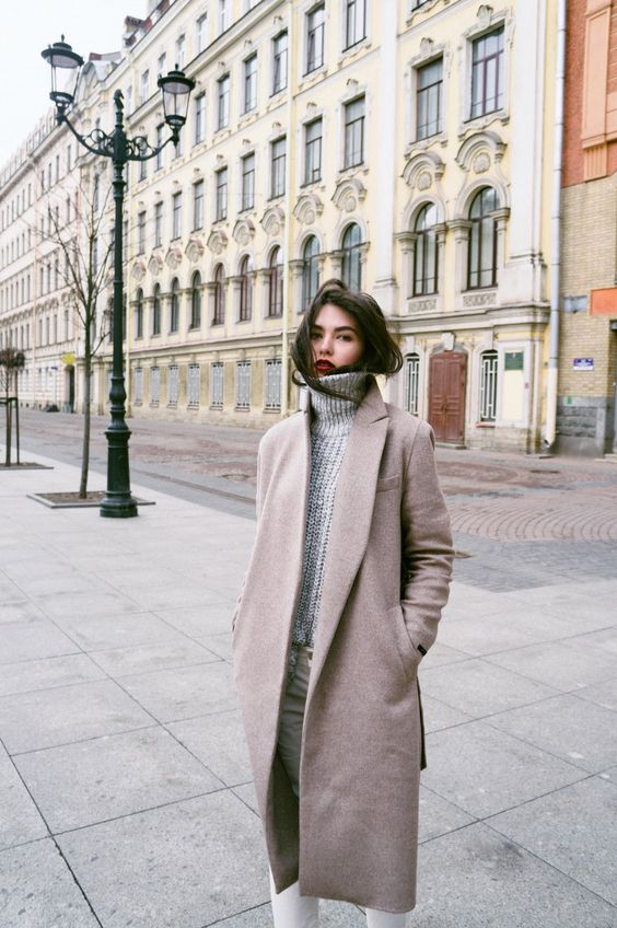 white jeans, a grey turtleneck sweater, a blush coat for a cozy winter look