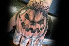 Cool pumpkin with angry smile tattoo