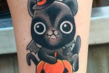 Cute bat with black hat and orange pumpkin tattoo