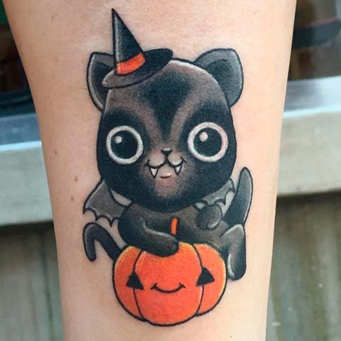 Cute bat with black hat and orange pumpkin tattoo