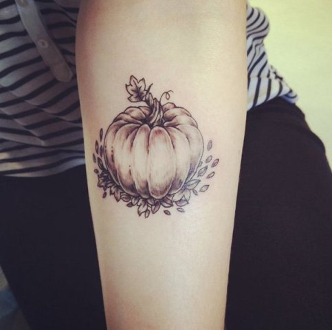Excellent pumpkin tattoo on the arm