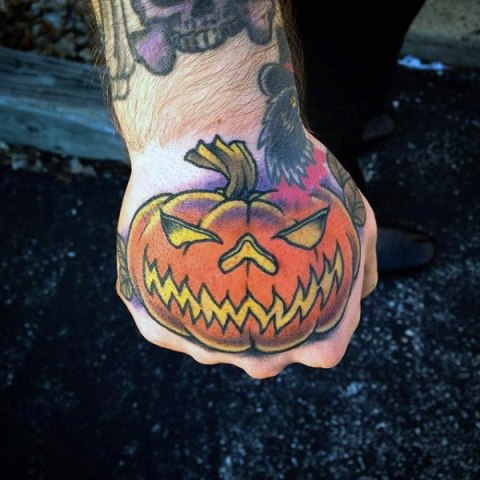 Funny orange pumpkin tattoo idea