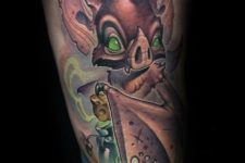 Green eyed goblin tattoo