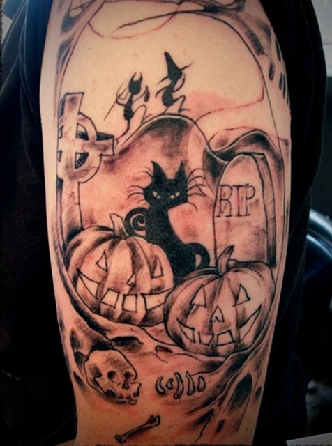 Half-sleeve black cat, pumpkins and skull tattoo