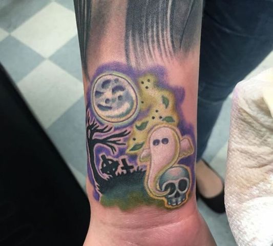 Halloween tattoo with ghost at the craveyard