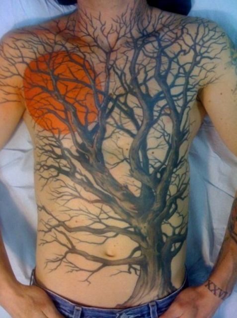 Moon and tree tattoo on the chest and stomach
