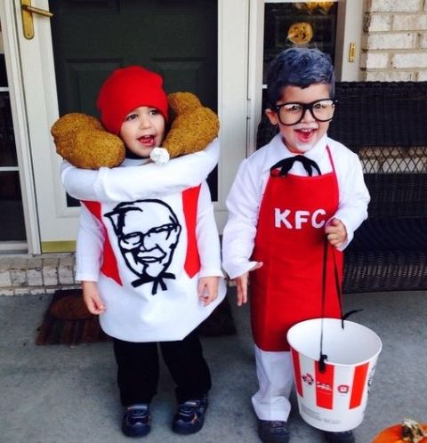 One boy as Sanders and other boy as bucket of fried chicken