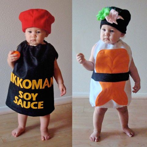 One boy as suchi and other boy as soy sause