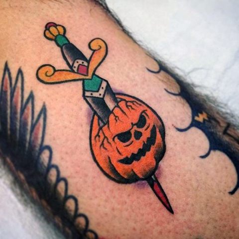 Pumpkin and sword tattoo